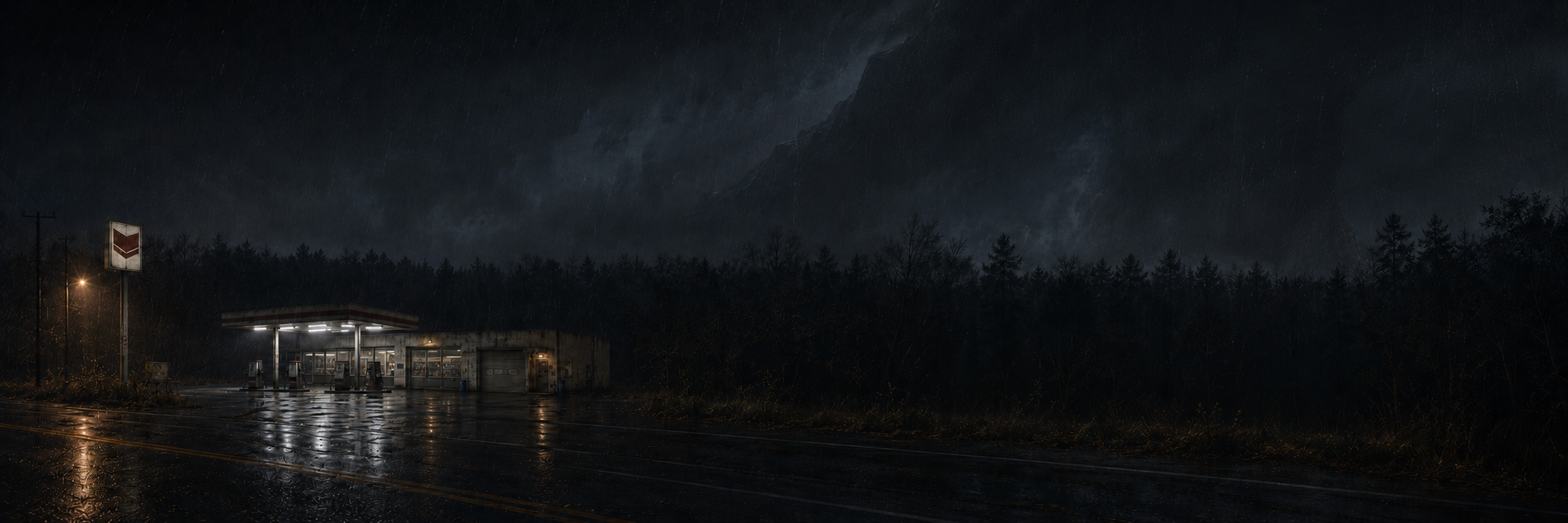 A lonely station occupies the far left of a wide rainy road while the storm's negative space suggests impossible volume.